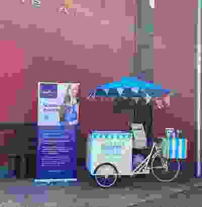 Ice-cream bike stand set up at entrance of Athy College with People First Credit Union pull up banners around it advertising their student loan.