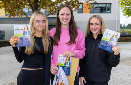 Girls Holding Leaflets