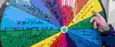 Picture of a spin wheel with prizes written on.